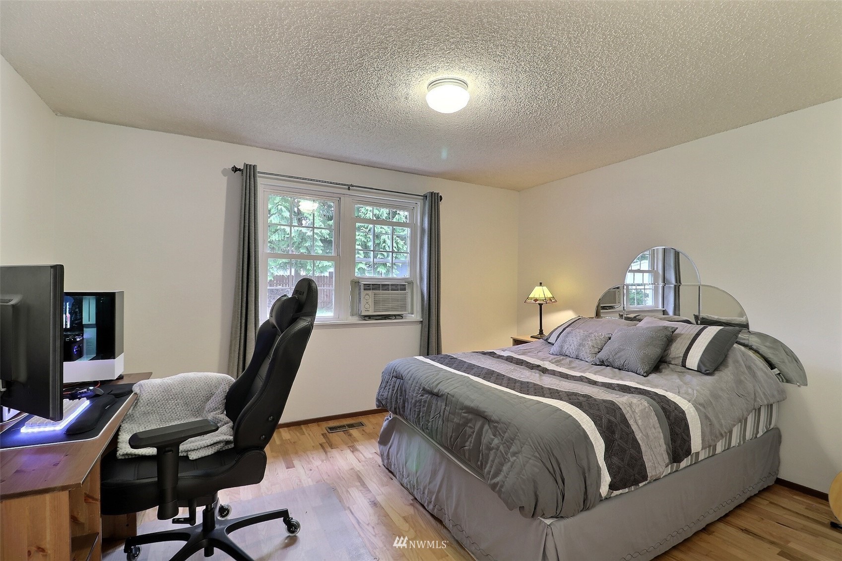 17234 139th Place Southeast Renton, WA 98058 - Photo 18 of 36 a bedroom with a bed a desk and chair