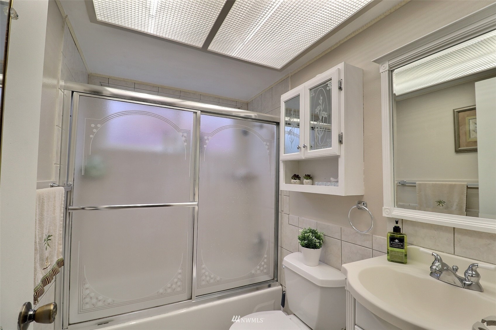 17234 139th Place Southeast Renton, WA 98058 - Photo 21 of 36 a bathroom with a shower toilet and sink