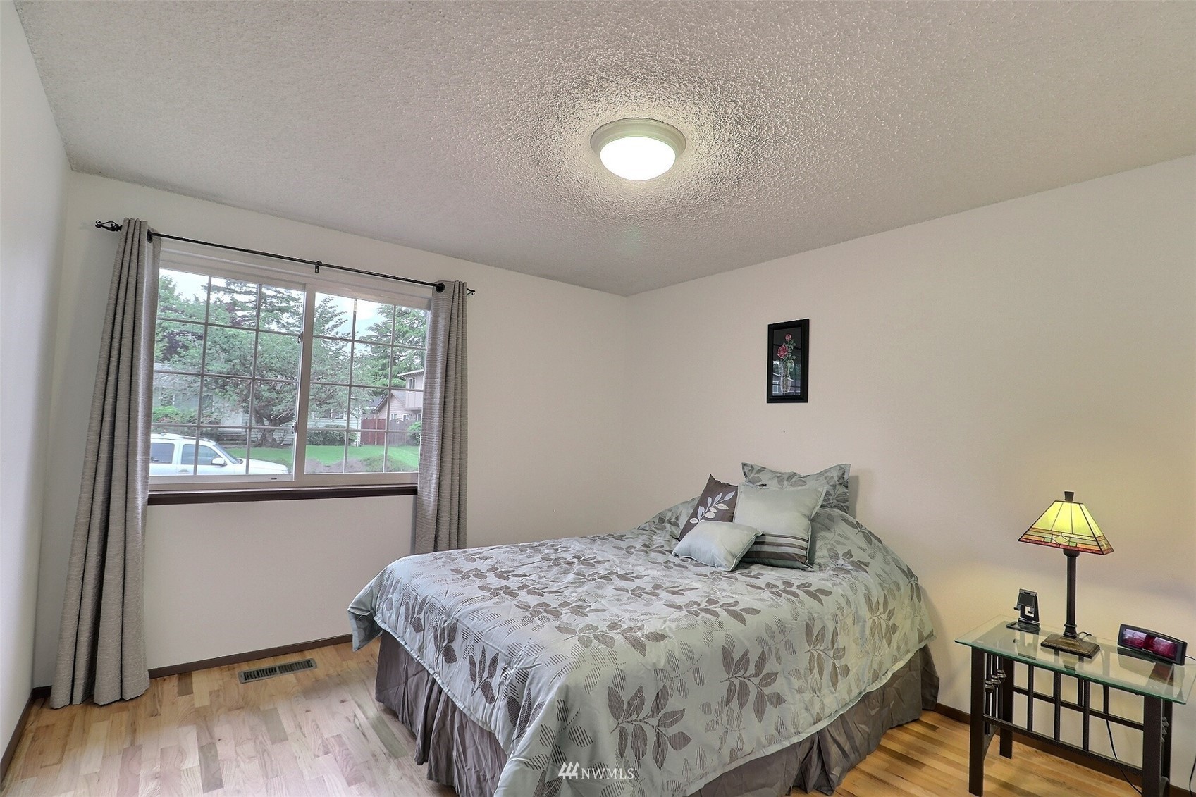 17234 139th Place Southeast Renton, WA 98058 - Photo 22 of 36 a bedroom with a bed and a window