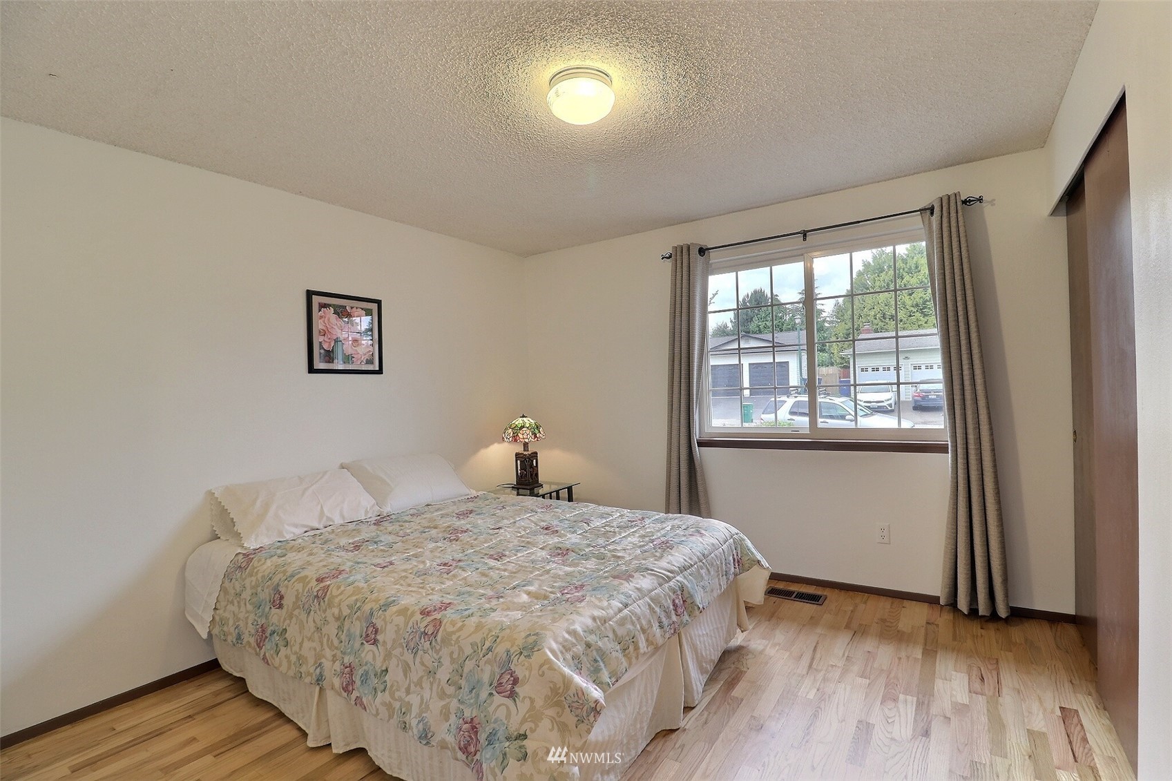 17234 139th Place Southeast Renton, WA 98058 - Photo 23 of 36 a bedroom with a bed and a window