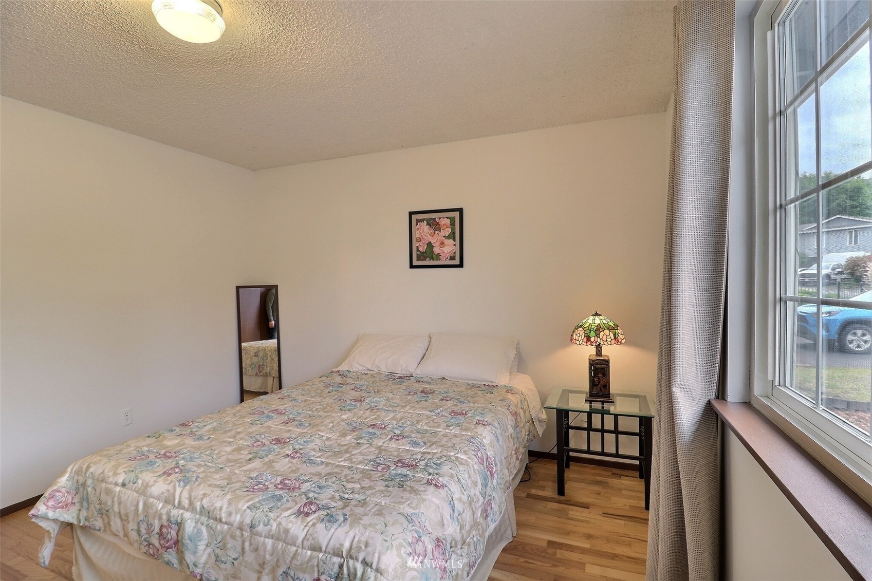 17234 139th Place Southeast Renton, WA 98058 - Photo 24 of 36 a bedroom with a bed and a window