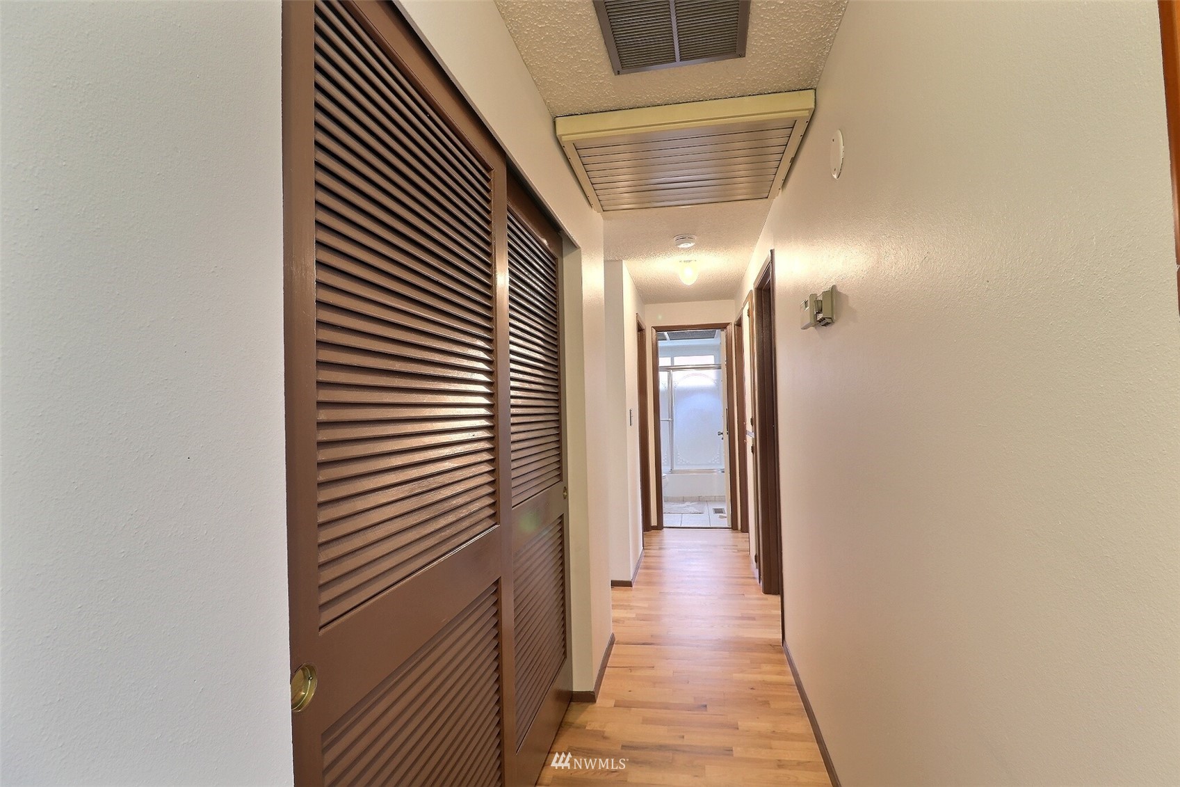 17234 139th Place Southeast Renton, WA 98058 - Photo 26 of 36 a view of a hallway with wooden floor