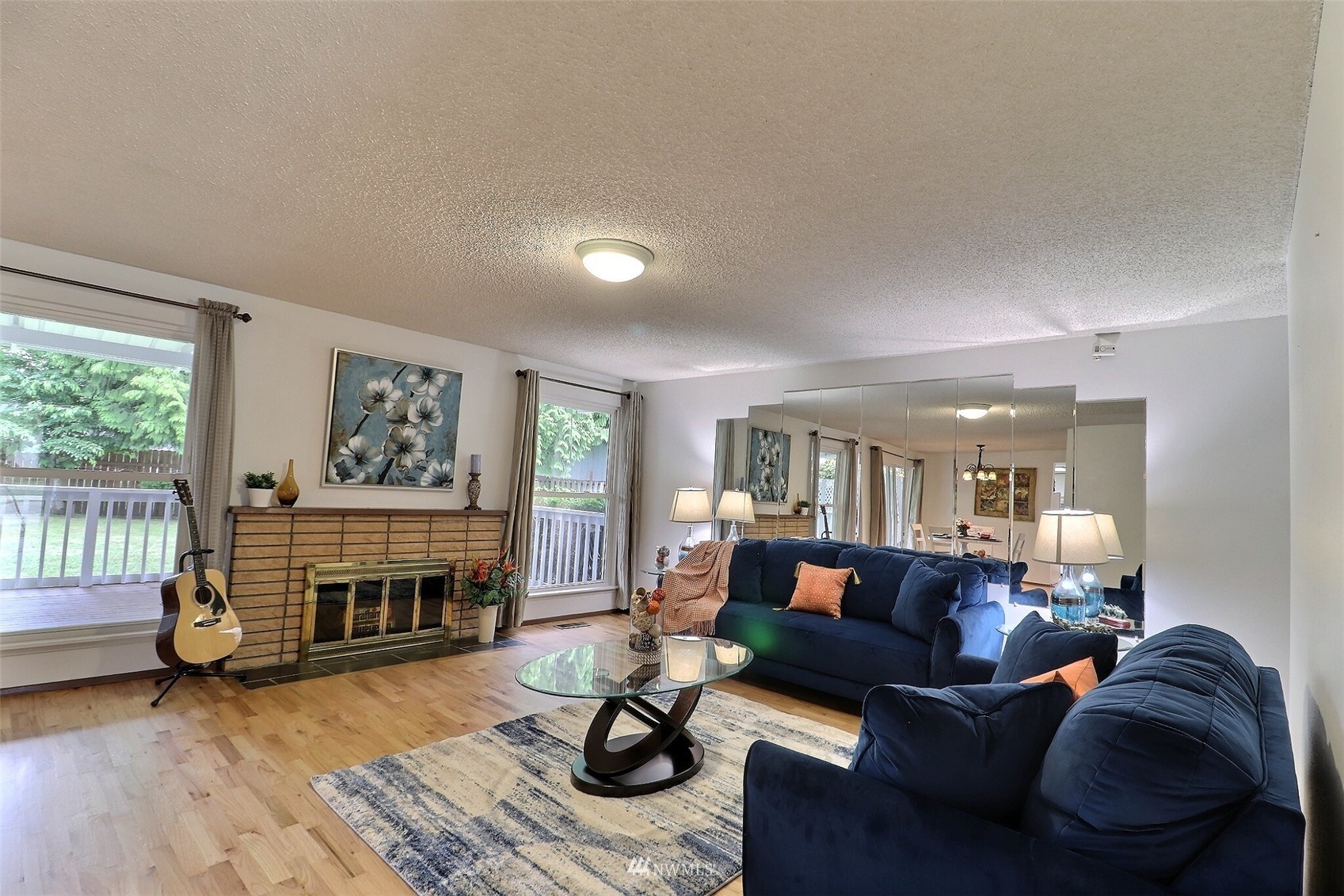 17234 139th Place Southeast Renton, WA 98058 - Photo 4 of 36 a living room with furniture and a fireplace