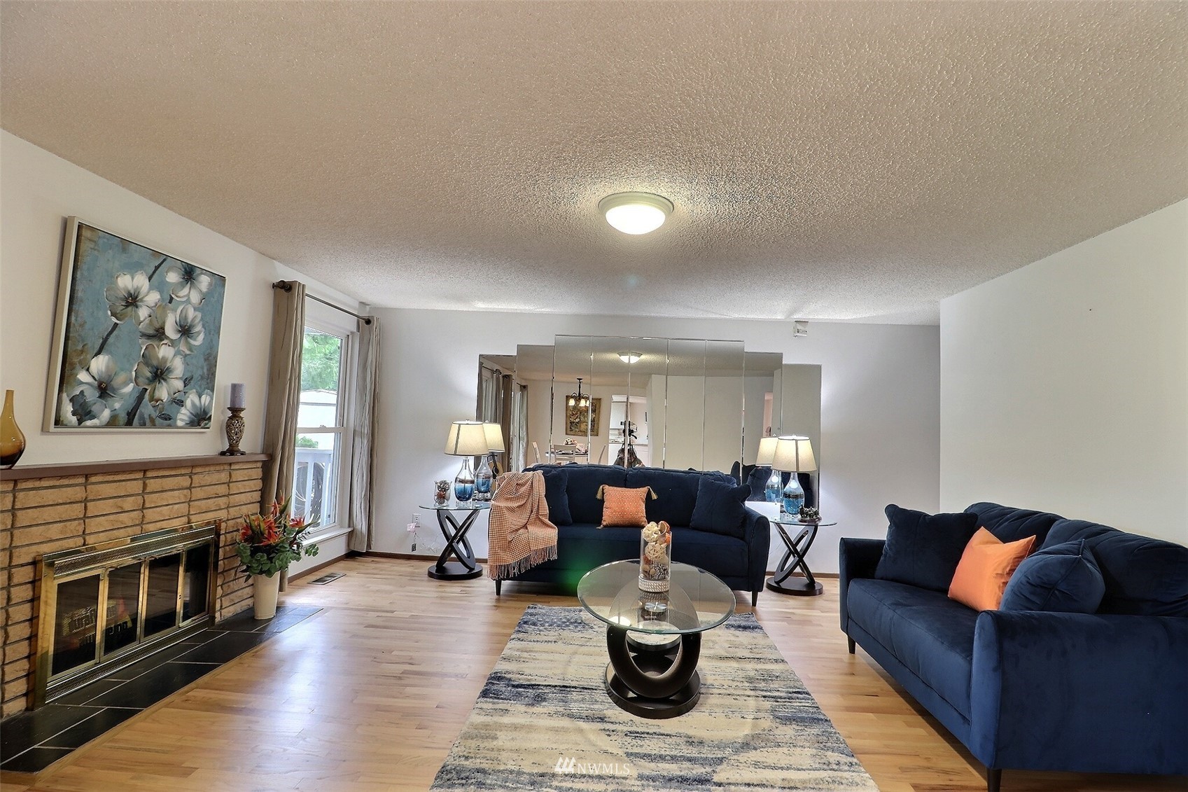 17234 139th Place Southeast Renton, WA 98058 - Photo 5 of 36 a living room with furniture fireplace and wooden floor