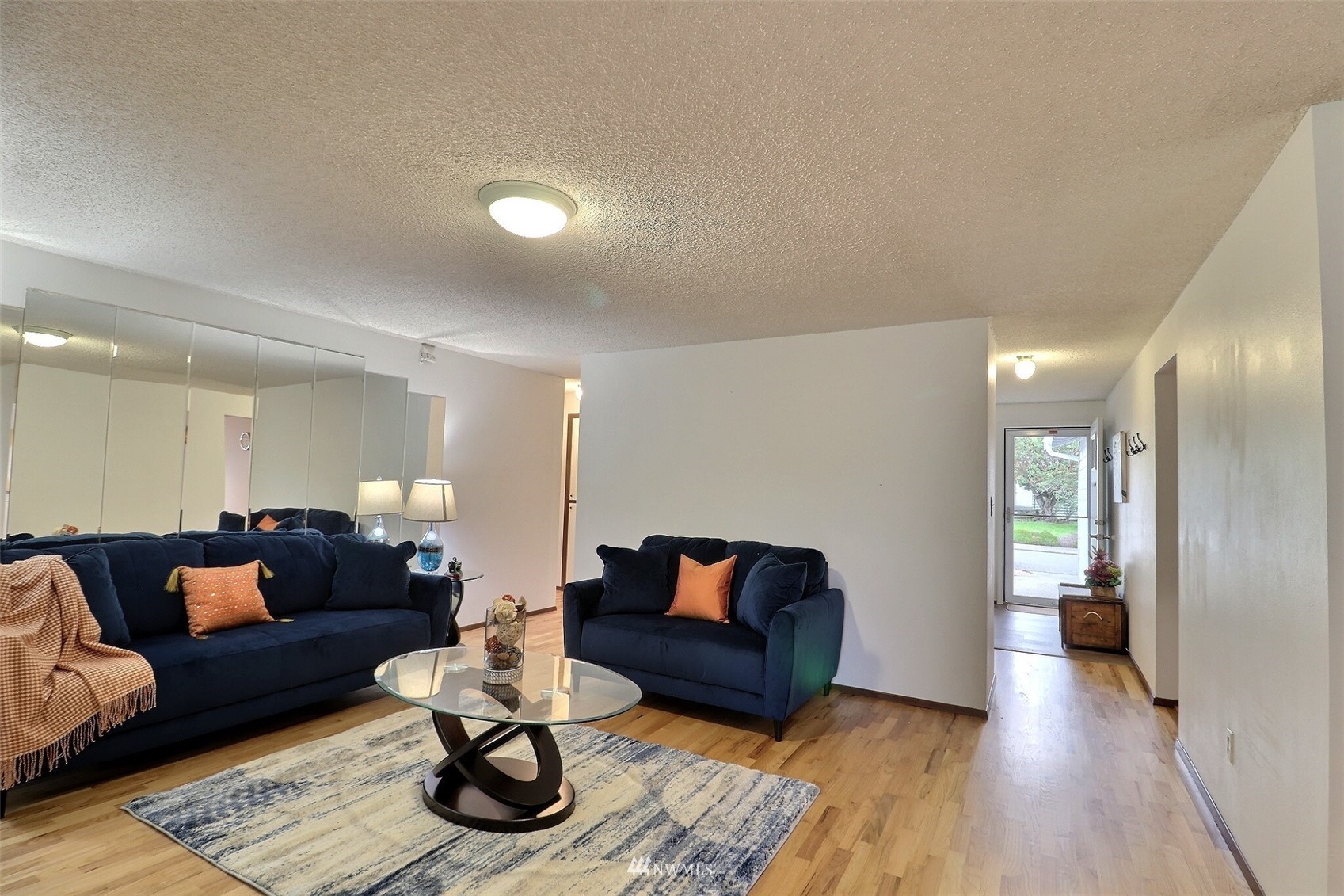 17234 139th Place Southeast Renton, WA 98058 - Photo 7 of 36 a living room with furniture and wooden floor