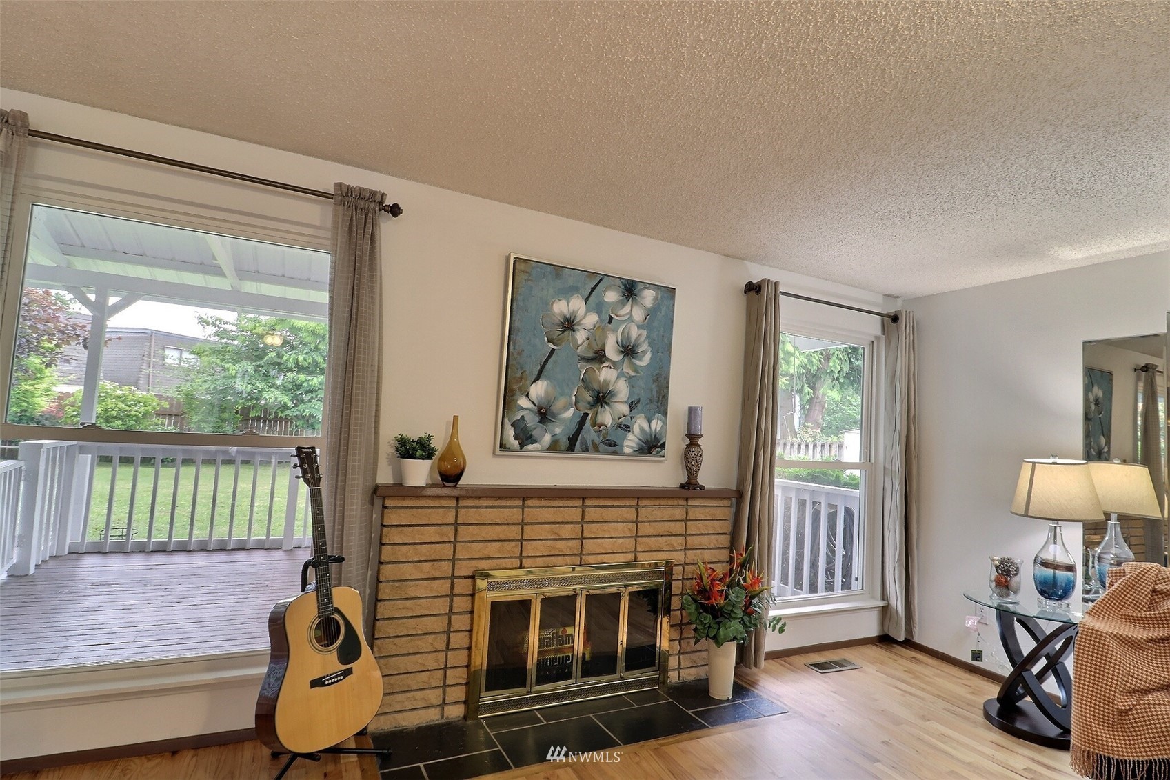 17234 139th Place Southeast Renton, WA 98058 - Photo 8 of 36 a living room with furniture a window and a flat screen tv