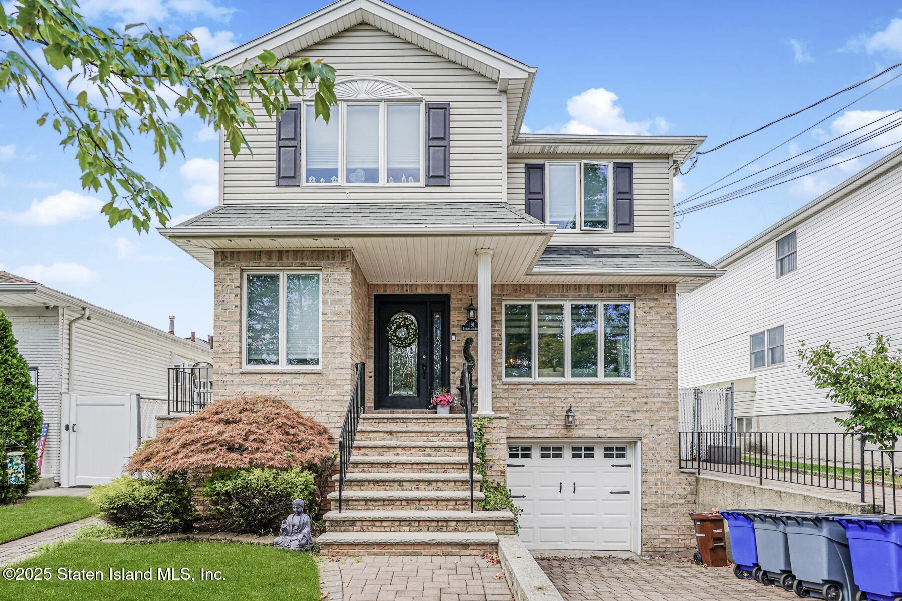 191 Rensselaer Avenue Staten Island, NY 10312 - Photo 1 of 36 a front view of a house with a garden