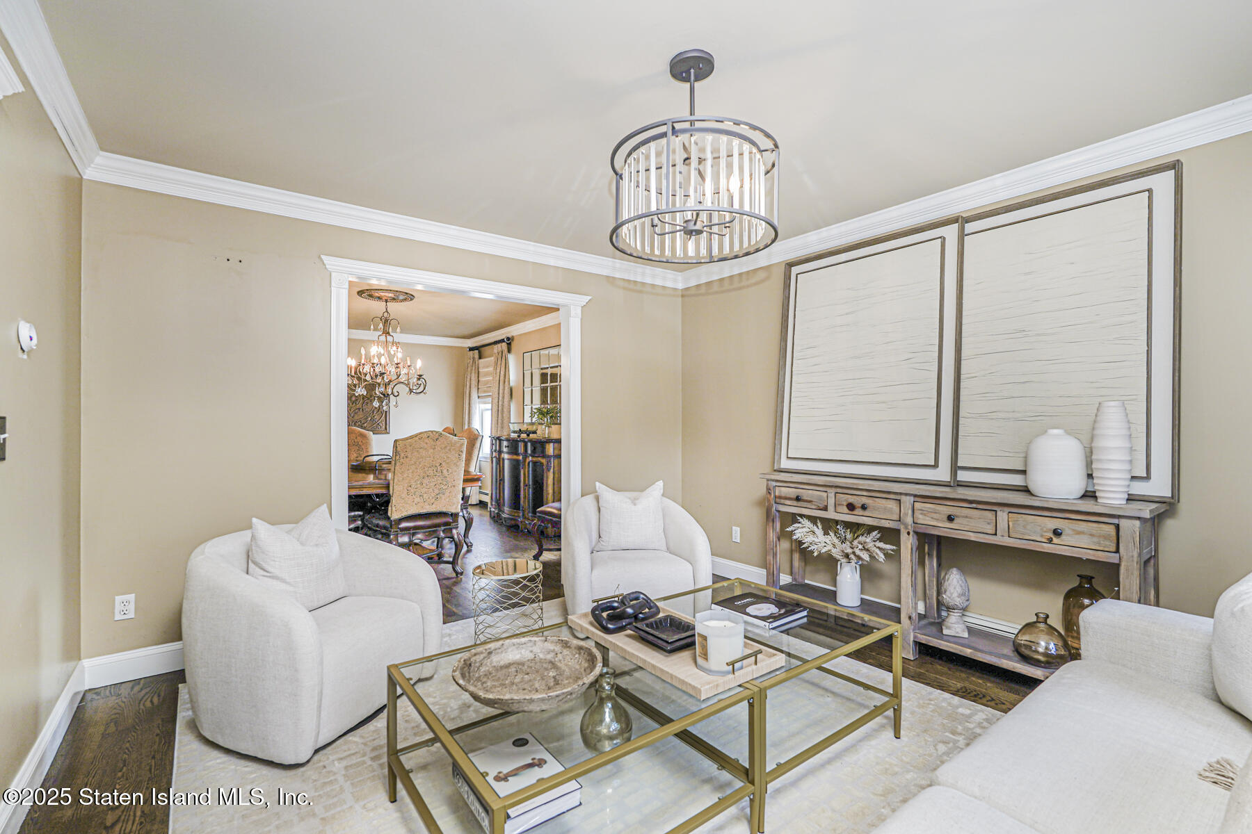 191 Rensselaer Avenue Staten Island, NY 10312 - Photo 11 of 36 a living room with furniture a chandelier and kitchen view