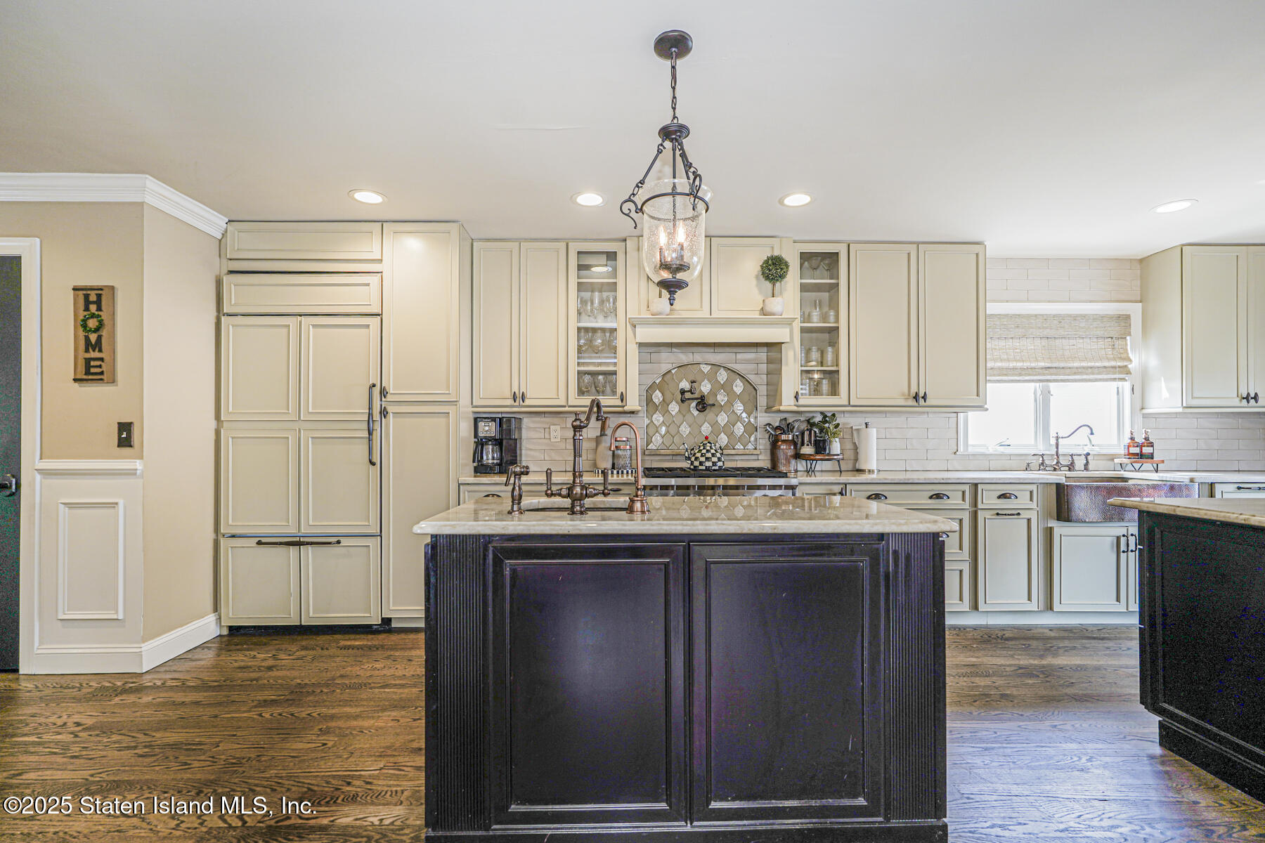 191 Rensselaer Avenue Staten Island, NY 10312 - Photo 12 of 36 a kitchen with kitchen island granite countertop a sink cabinets and stainless steel appliances