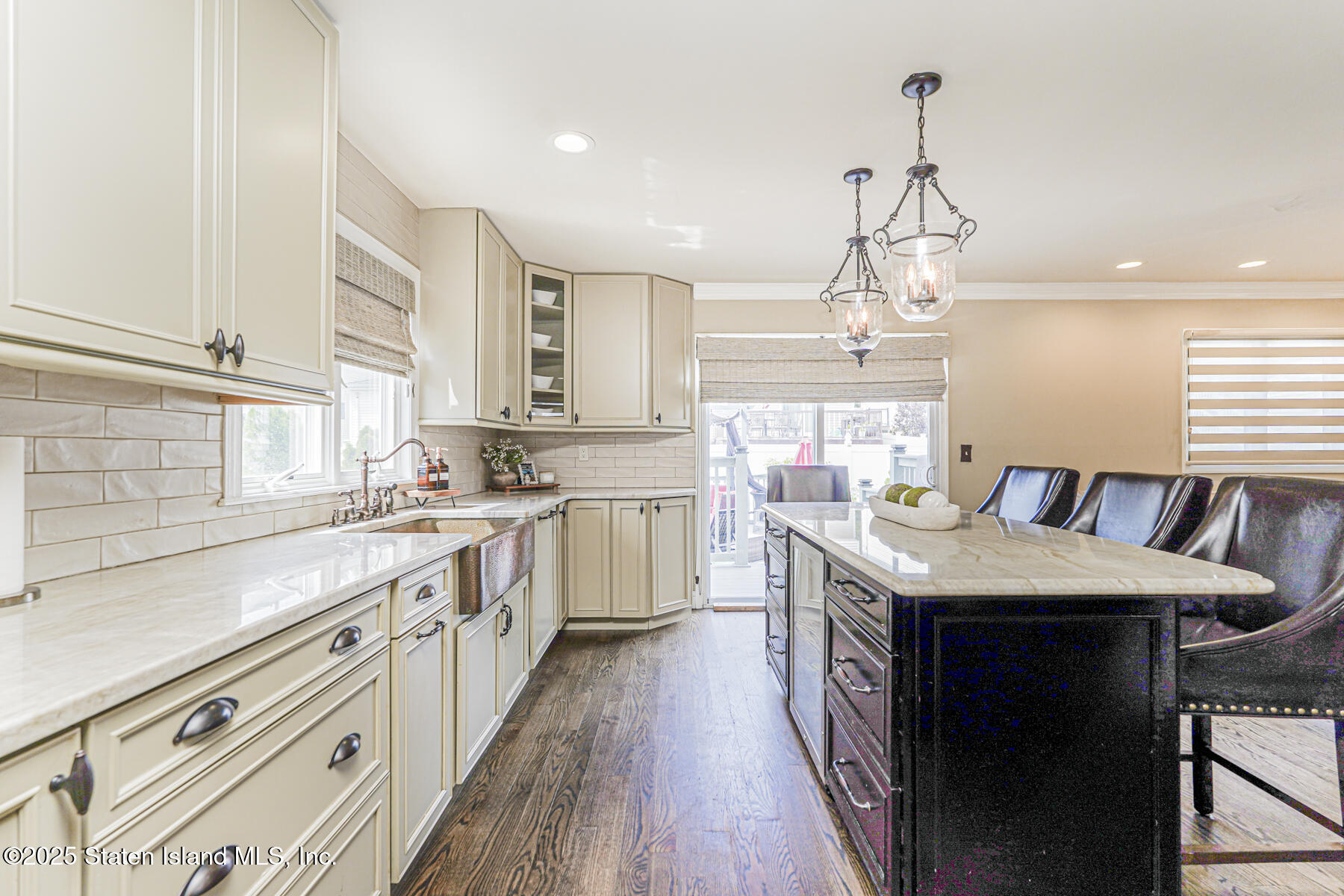 191 Rensselaer Avenue Staten Island, NY 10312 - Photo 14 of 36 a kitchen with stainless steel appliances granite countertop a sink stove and cabinets