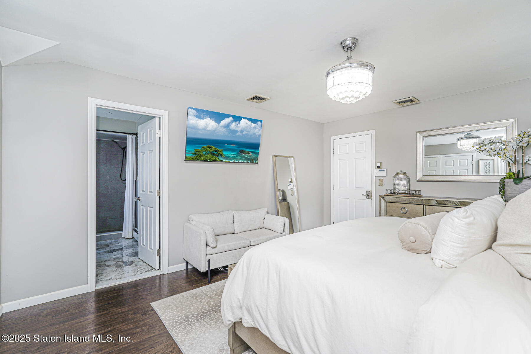 191 Rensselaer Avenue Staten Island, NY 10312 - Photo 29 of 36 a bedroom with a bed and a window