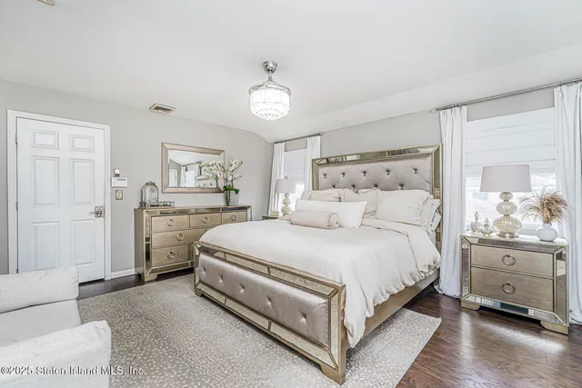 a bed room with a bed and a cabinets