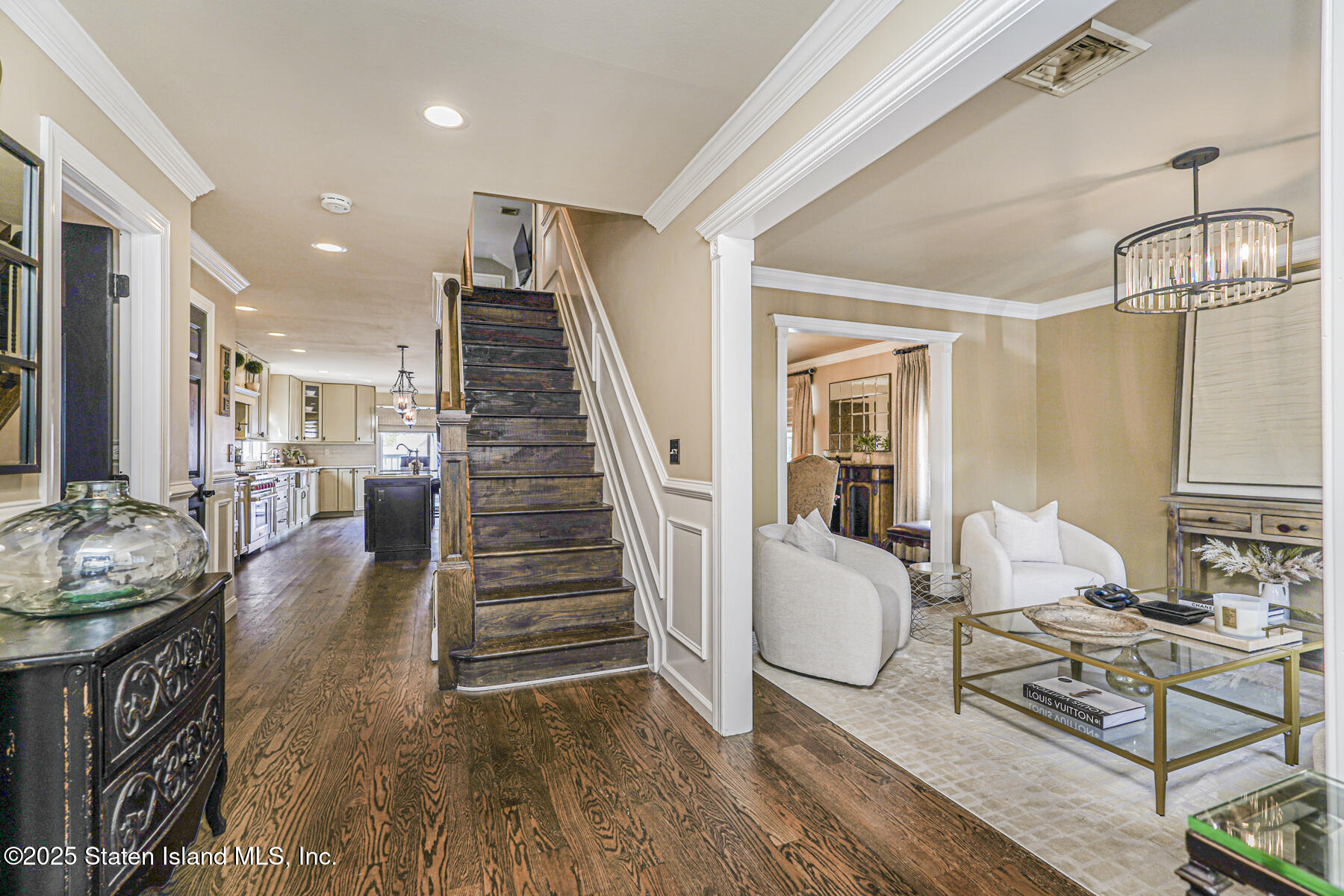 191 Rensselaer Avenue Staten Island, NY 10312 - Photo 3 of 36 a living room with furniture and wooden floor