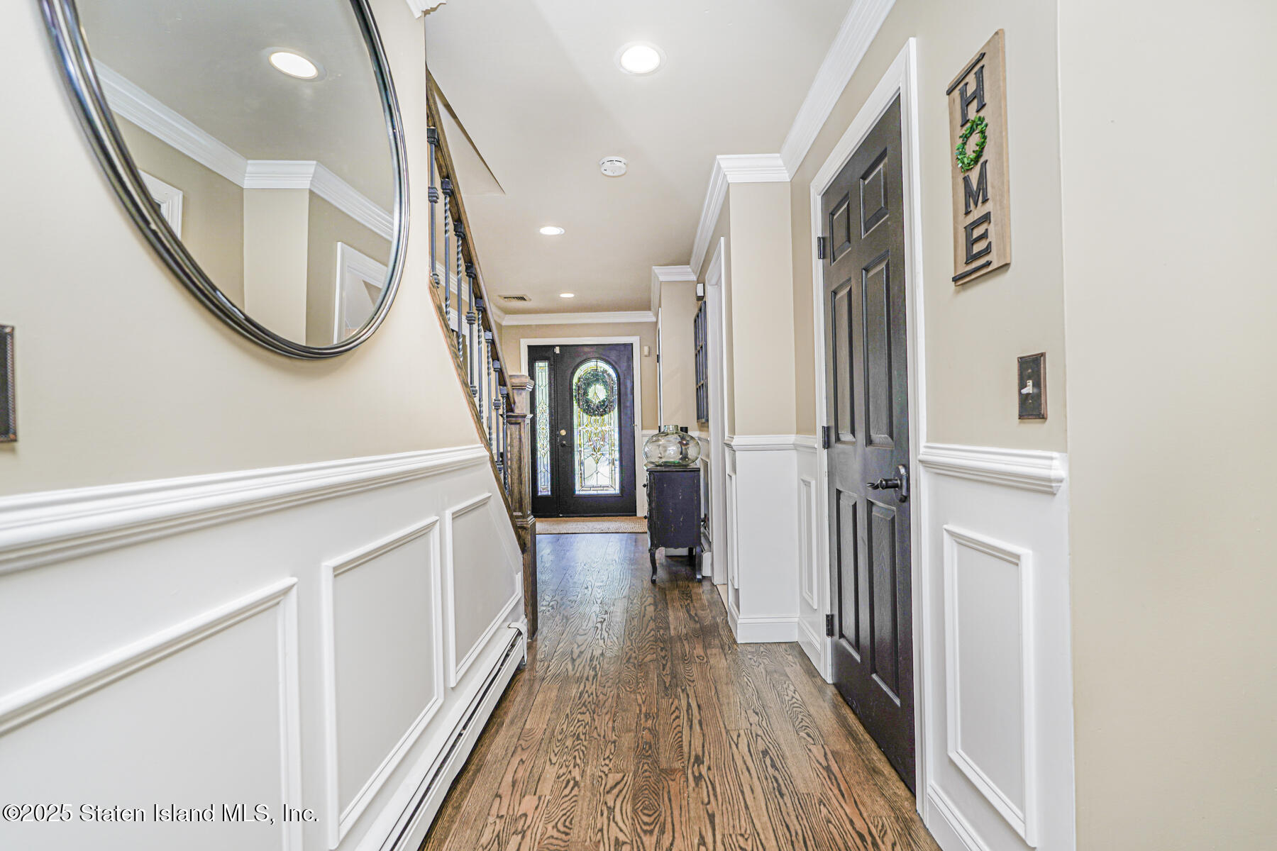 191 Rensselaer Avenue Staten Island, NY 10312 - Photo 5 of 36 a view of a hallway with wooden floor