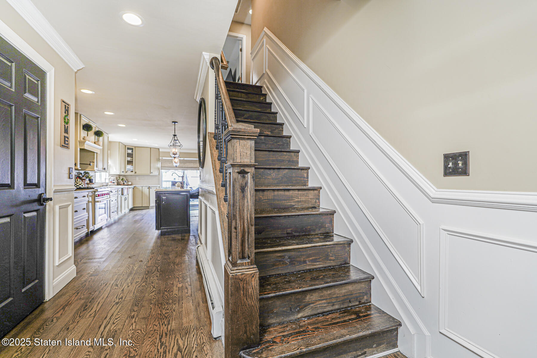 191 Rensselaer Avenue Staten Island, NY 10312 - Photo 7 of 36 a view of a kitchen with wooden floor and electronic appliances