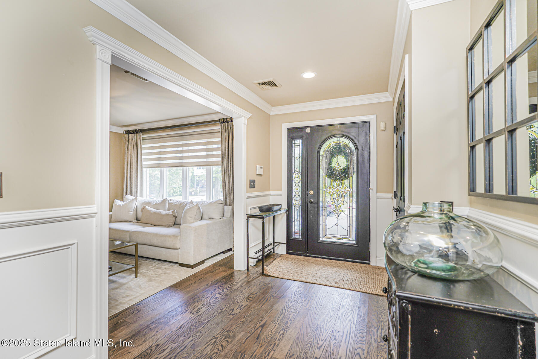 191 Rensselaer Avenue Staten Island, NY 10312 - Photo 8 of 36 a living room with furniture and a large window