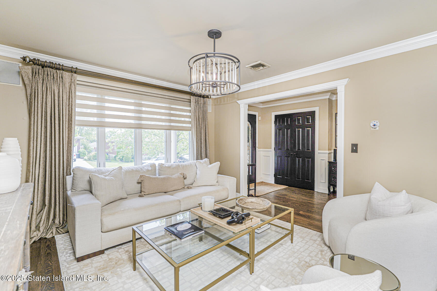 191 Rensselaer Avenue Staten Island, NY 10312 - Photo 9 of 36 a living room with furniture a table and a large window