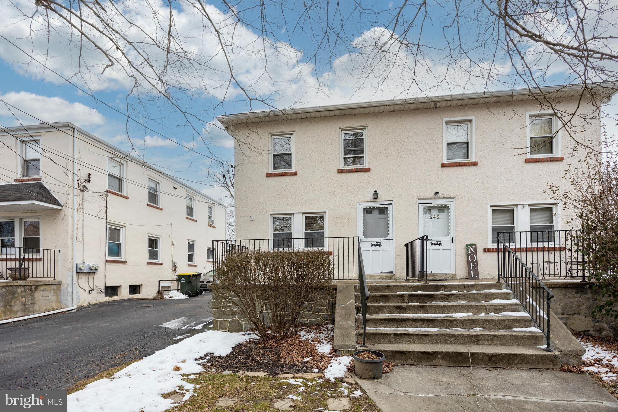 a view of a white building with many windows