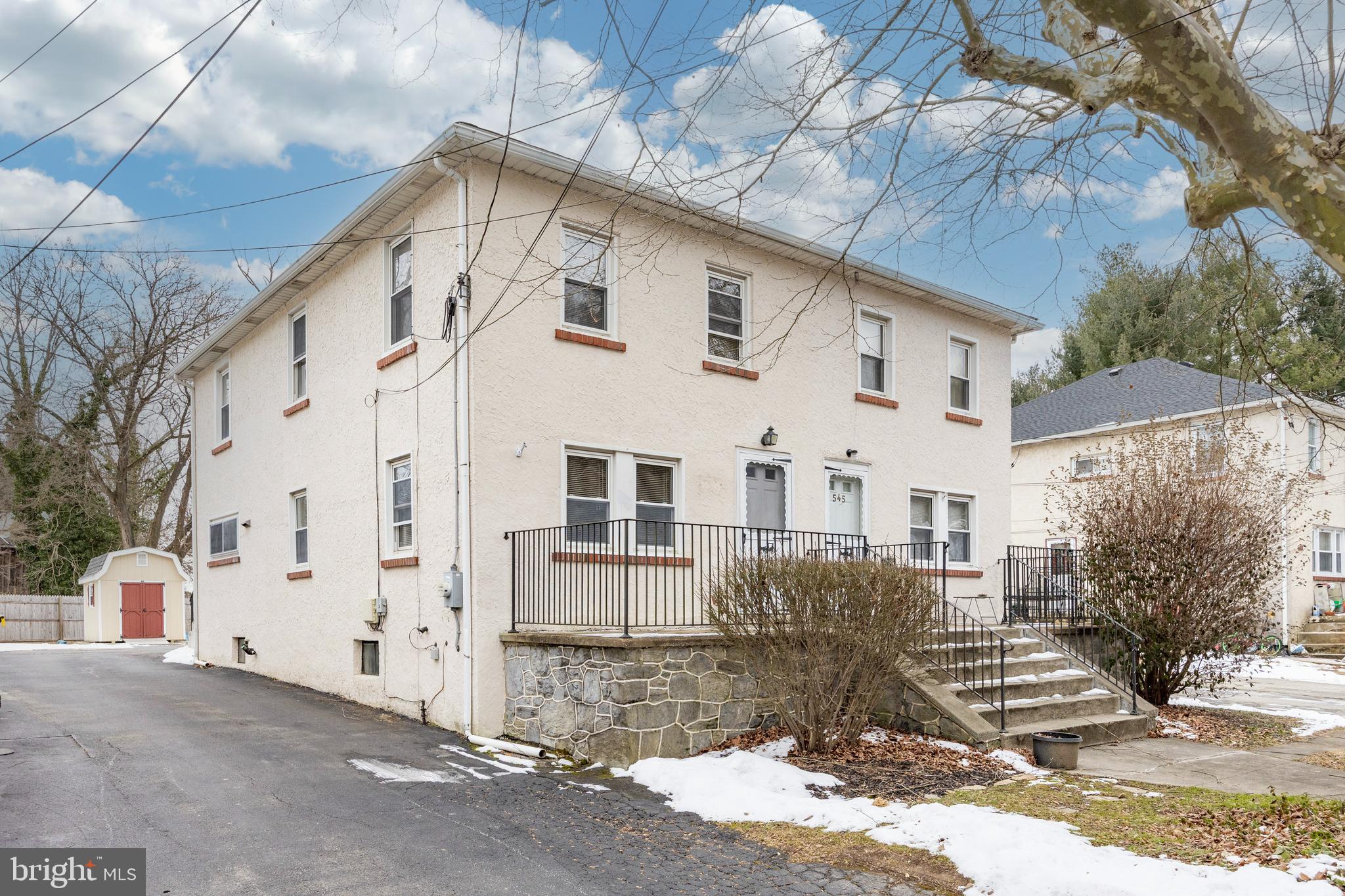 547 Northbrook Road West Chester, PA 19382 - Photo 24 of 35 a view of a white house with a yard and garage