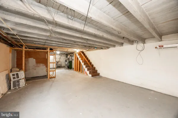 a view of empty room with wooden ceiling