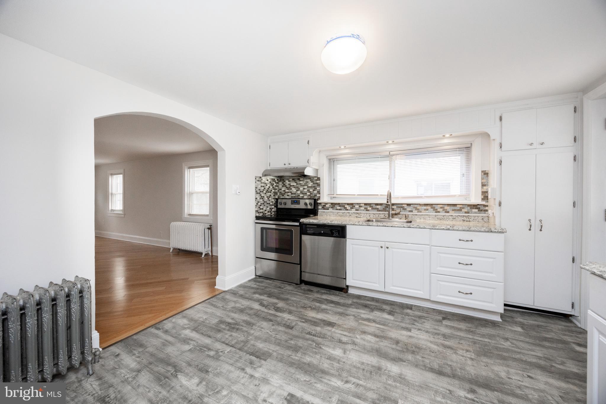 547 Northbrook Road West Chester, PA 19382 - Photo 6 of 35 a kitchen with granite countertop white cabinets and appliances