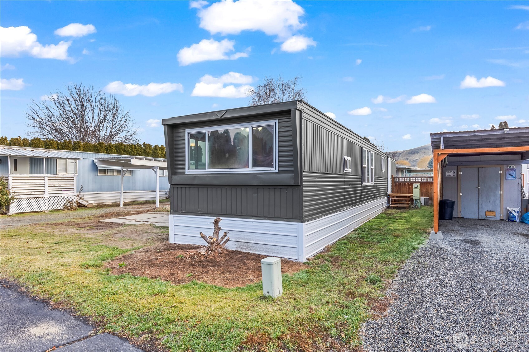 110 Sage Trail Road, Unit 13 Yakima, WA 98901 - Photo 12 of 16 a front view of a house with a yard