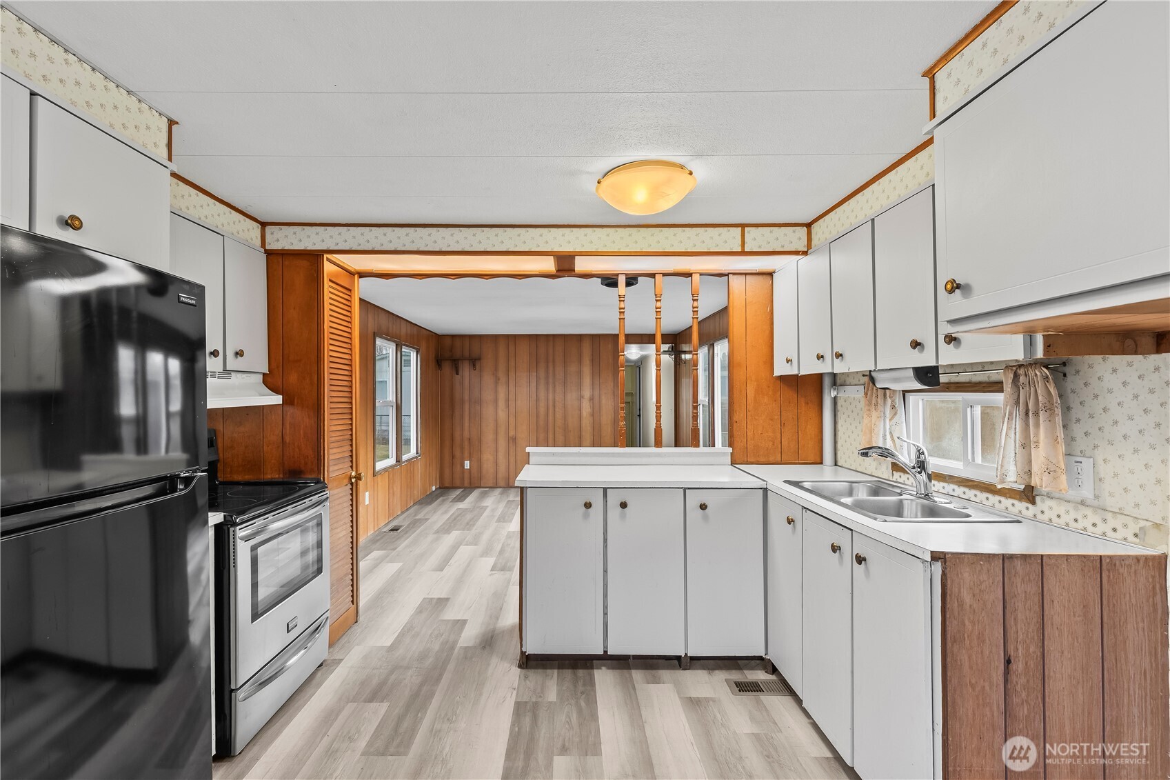 110 Sage Trail Road, Unit 13 Yakima, WA 98901 - Photo 5 of 16 a kitchen with a sink stove and refrigerator