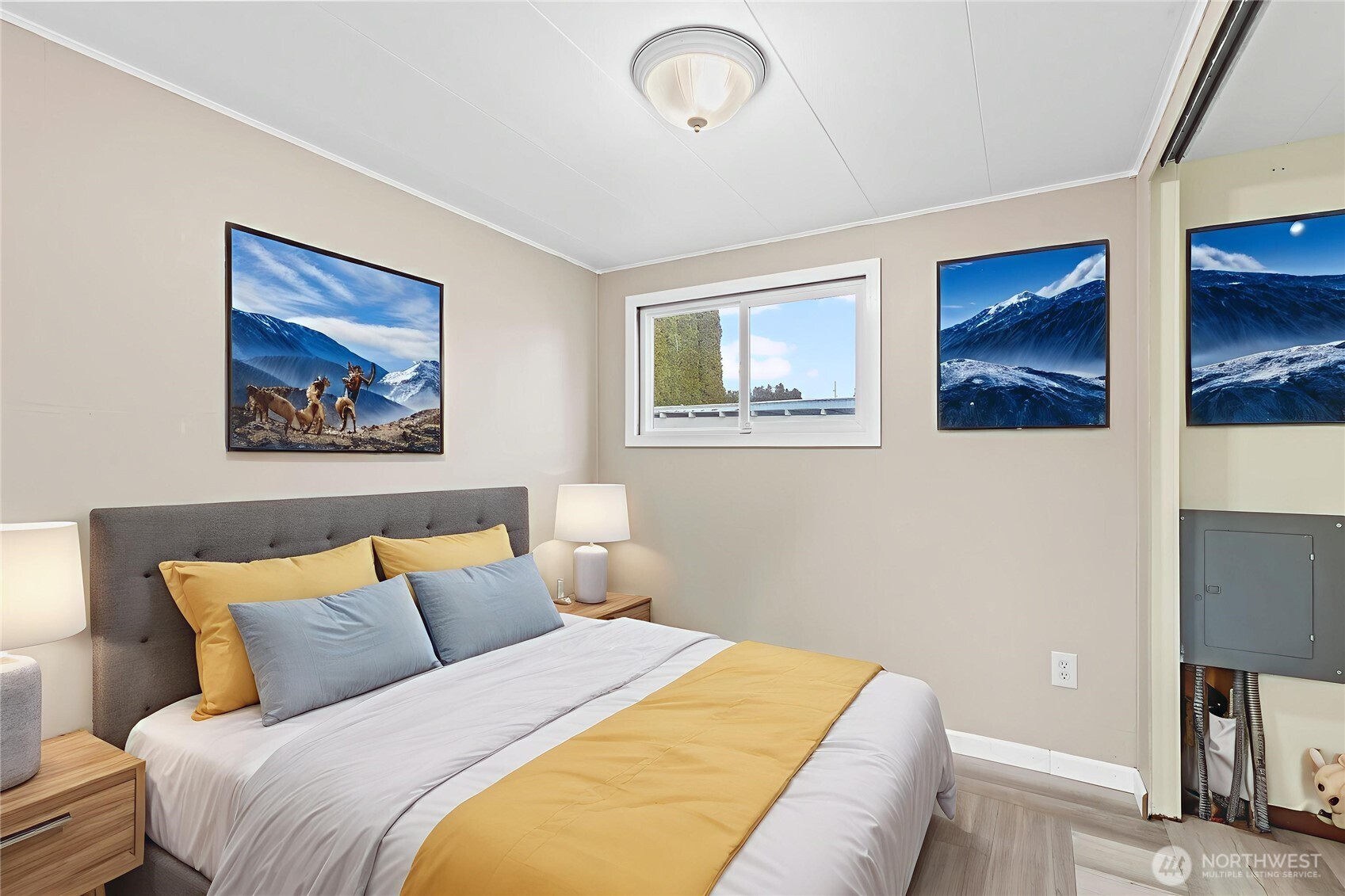 110 Sage Trail Road, Unit 13 Yakima, WA 98901 - Photo 8 of 16 a bedroom with bed and a painting on the wall