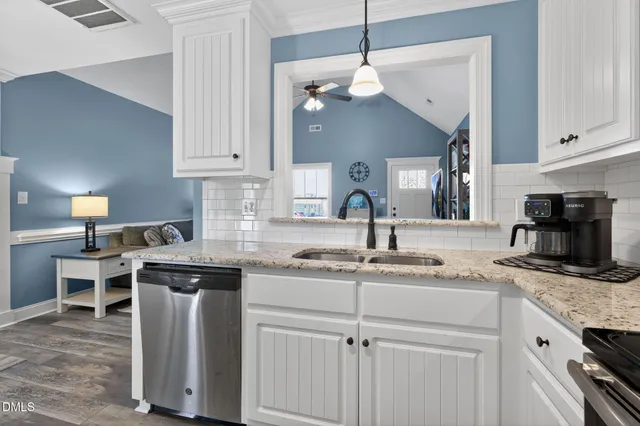 a kitchen with a sink and cabinets