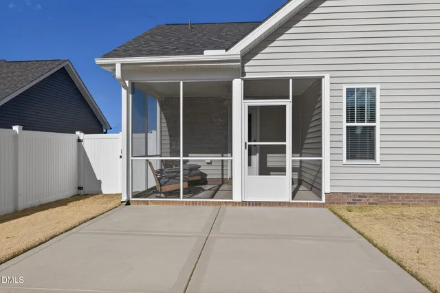 a view of a house with a door and a window