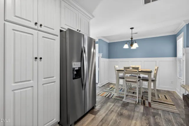 a view of kitchen with furniture and wooden floor
