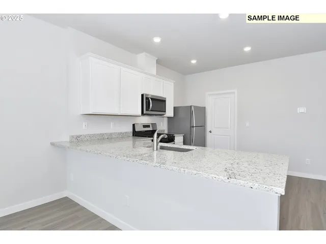 a kitchen with a stove and a microwave