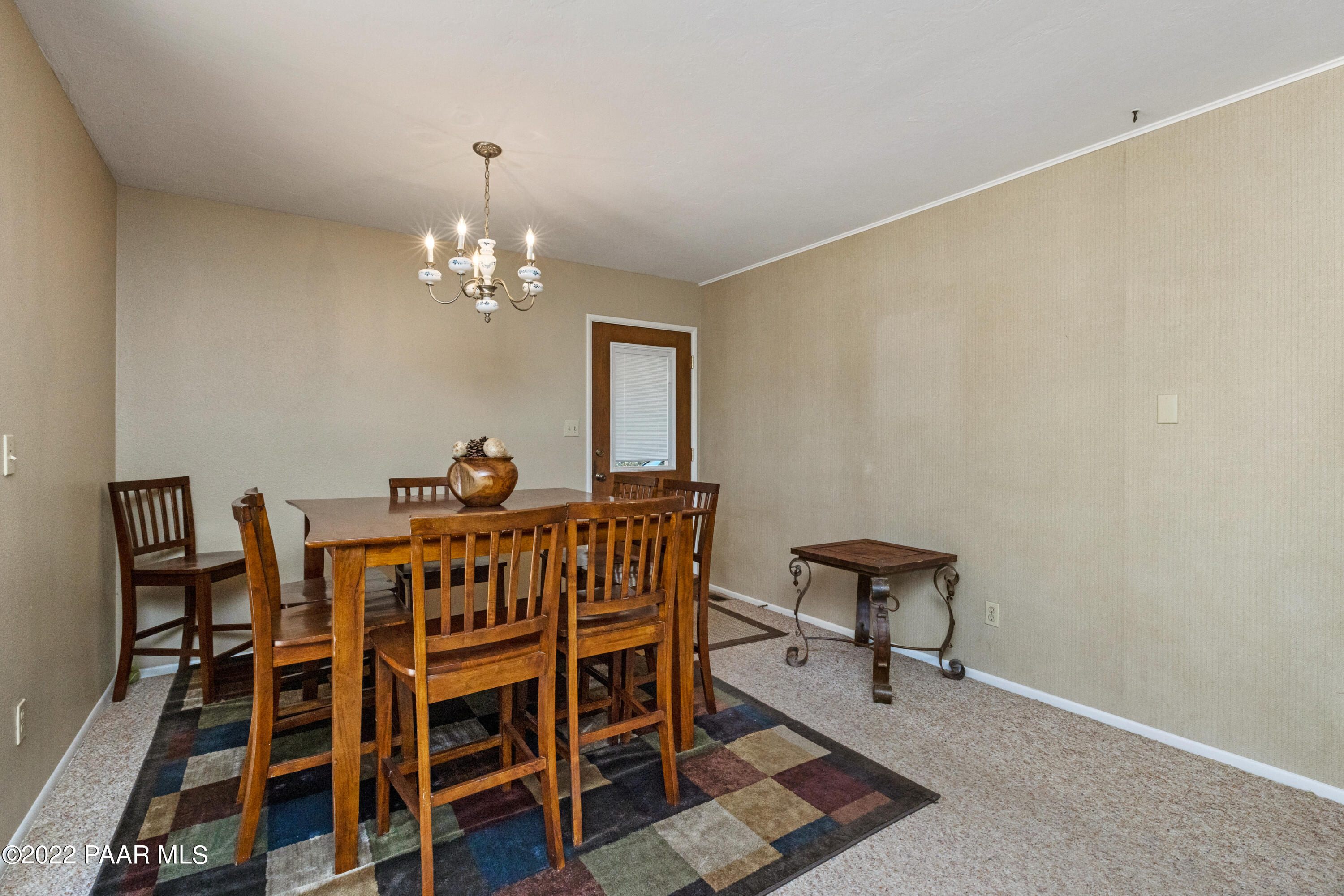 1481 West Cliff Rose Road Prescott, AZ 86305 - Photo 13 of 38 a view of a dining room with furniture and chandelier