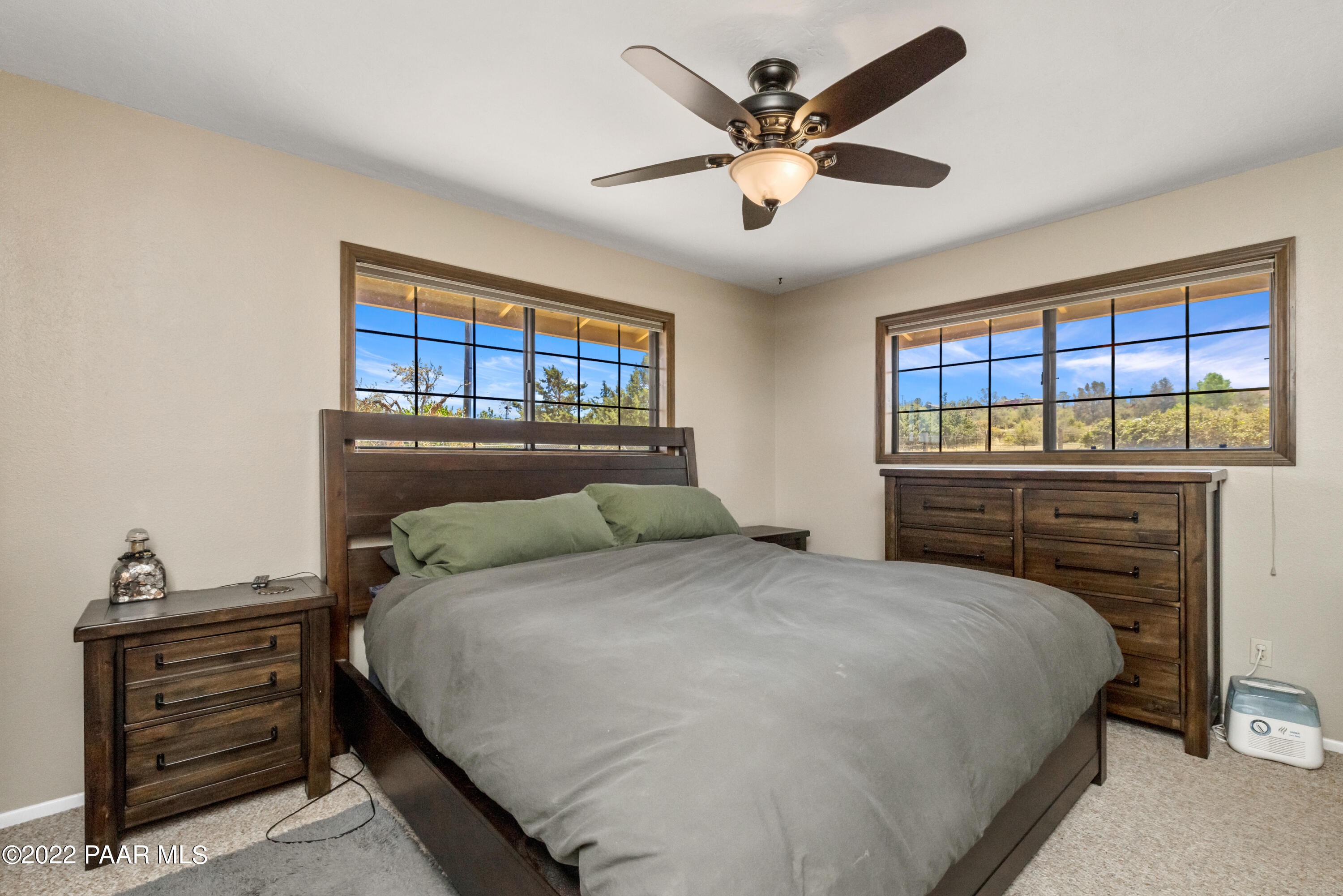 1481 West Cliff Rose Road Prescott, AZ 86305 - Photo 14 of 38 a bedroom with a large bed and a dresser