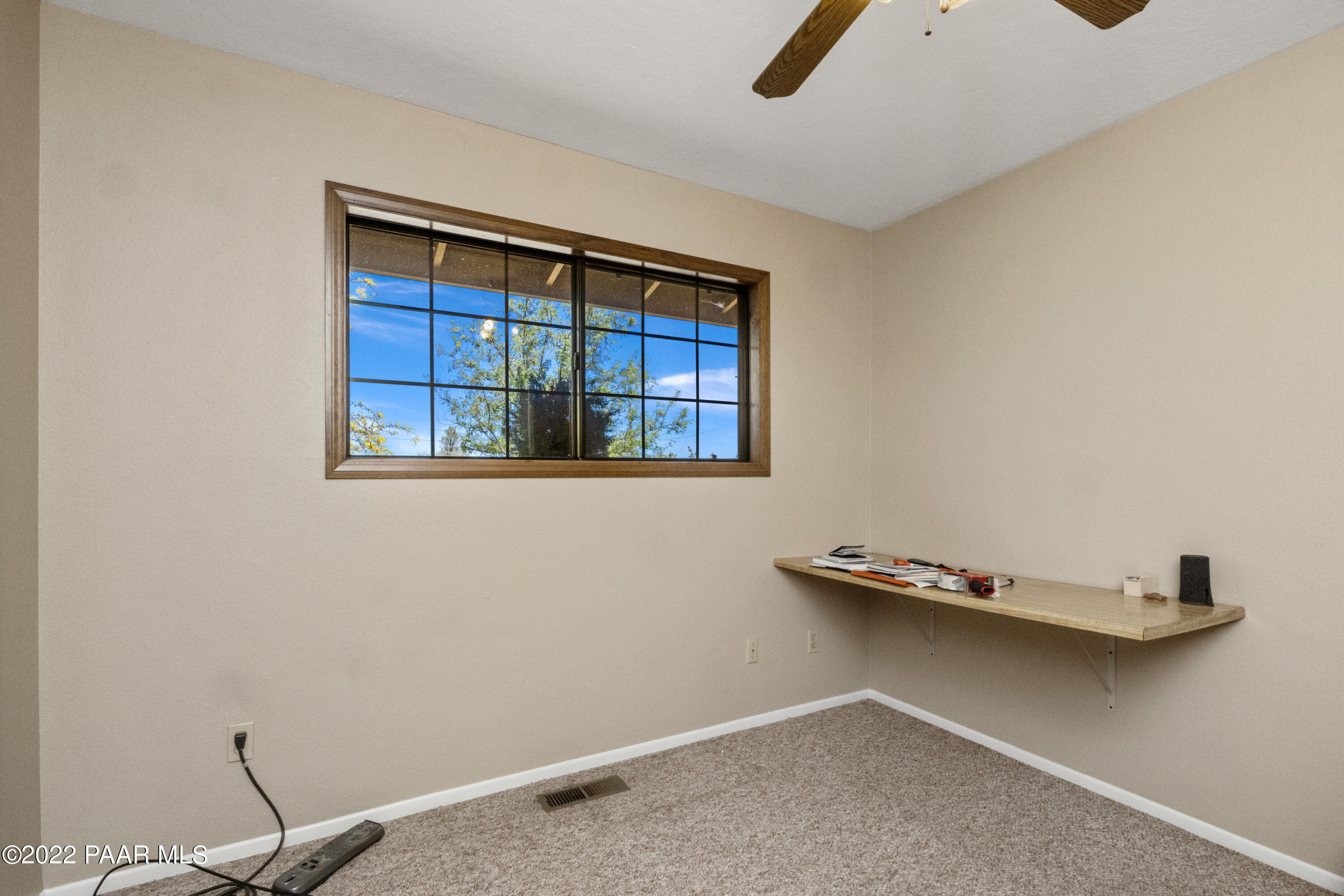 1481 West Cliff Rose Road Prescott, AZ 86305 - Photo 18 of 38 a view of an empty room with windows