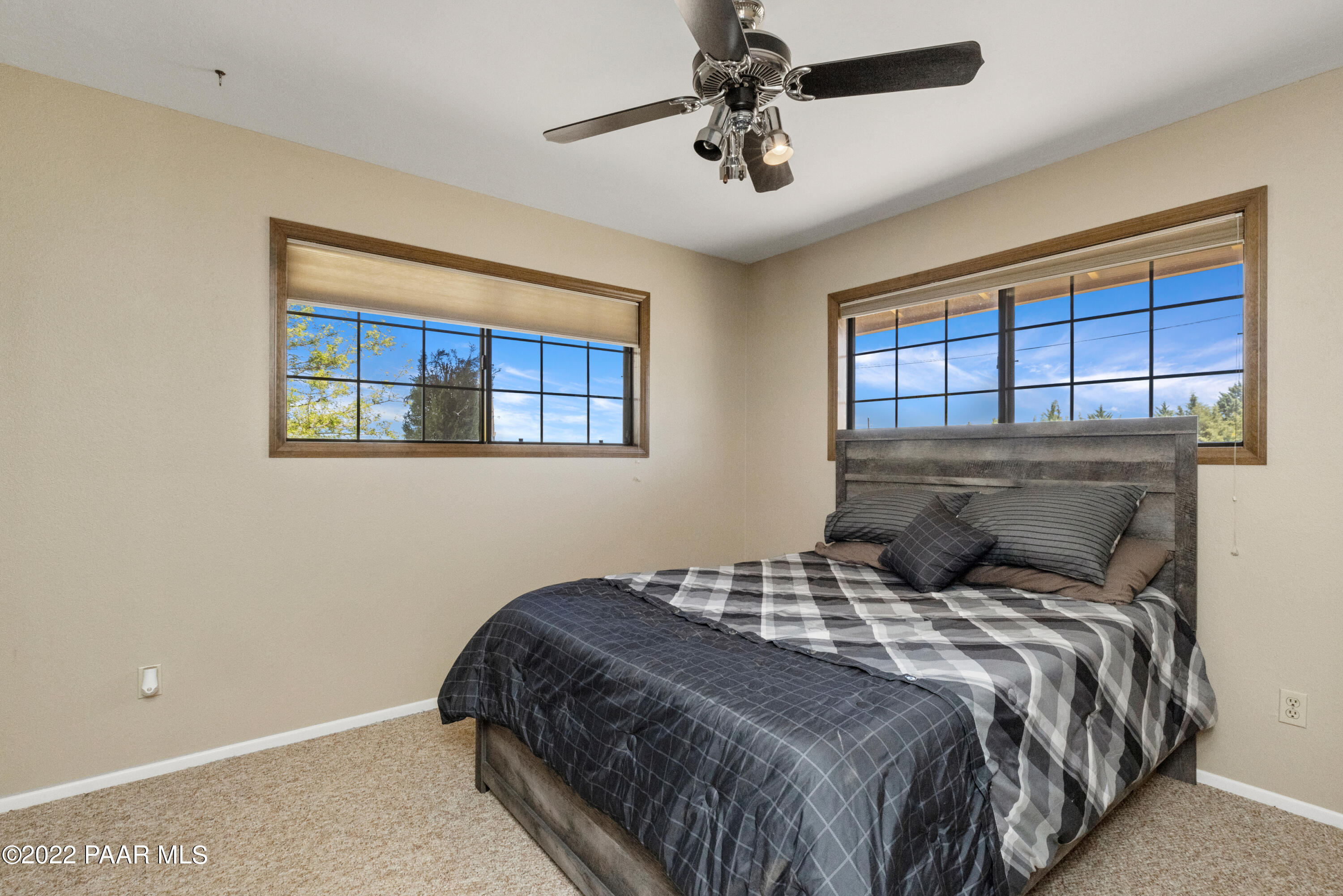 1481 West Cliff Rose Road Prescott, AZ 86305 - Photo 21 of 38 a bedroom with a large bed and a window