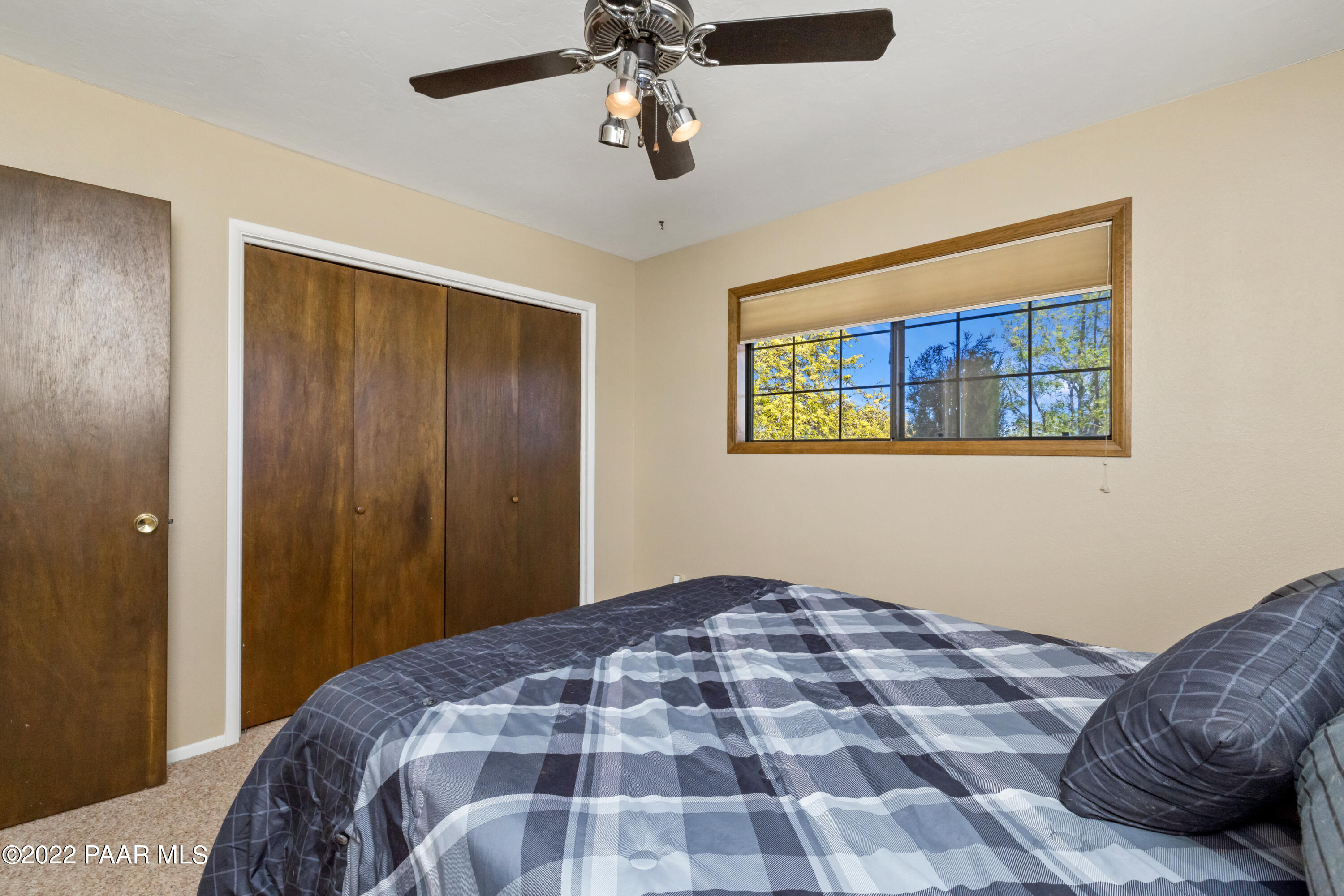 1481 West Cliff Rose Road Prescott, AZ 86305 - Photo 22 of 38 a bedroom with a bed and a painting on the wall