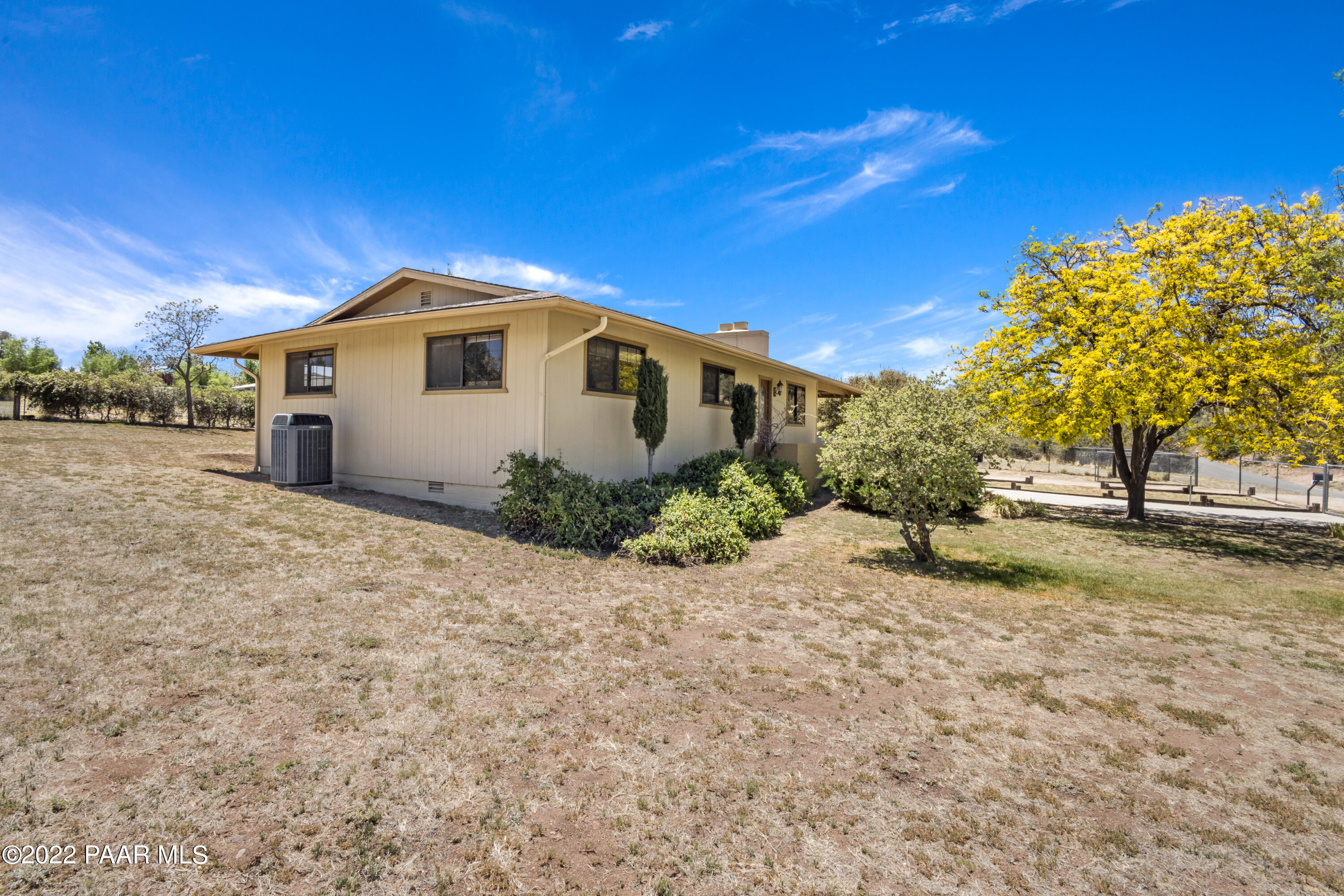 1481 West Cliff Rose Road Prescott, AZ 86305 - Photo 23 of 38 a front view of a house with a yard