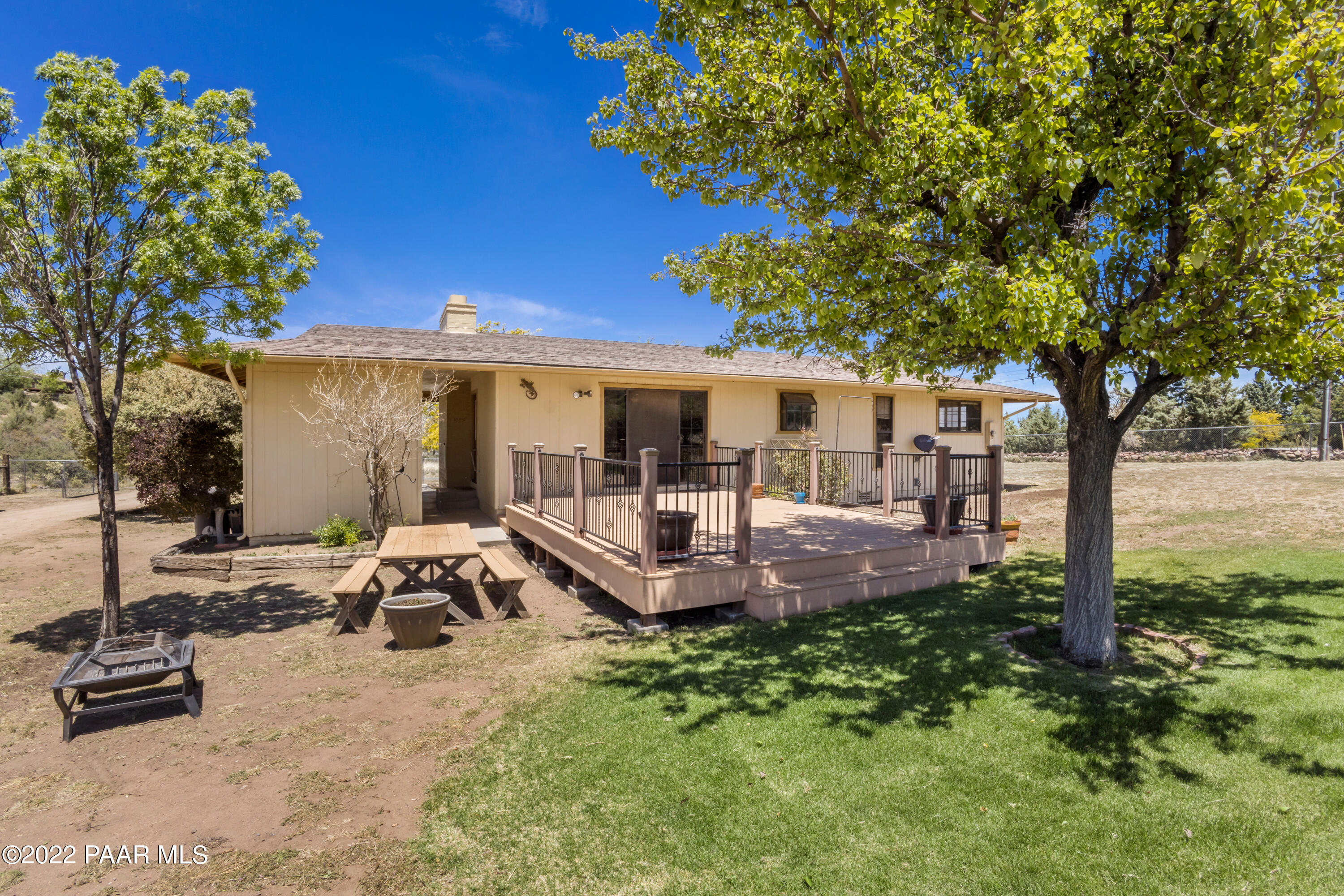 1481 West Cliff Rose Road Prescott, AZ 86305 - Photo 27 of 38 a view of a backyard with plants and a patio