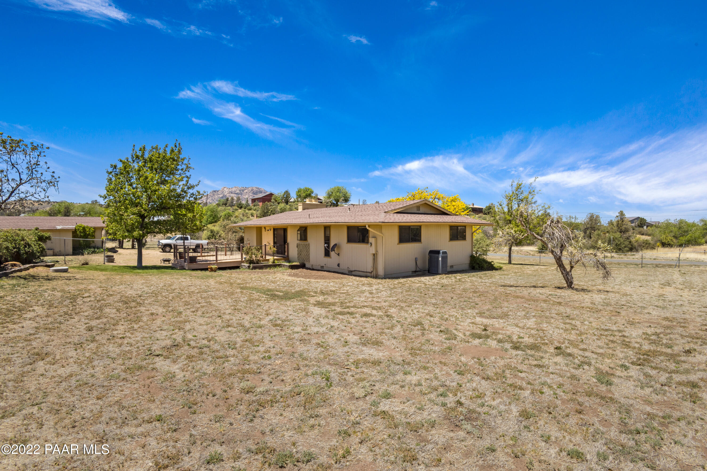 1481 West Cliff Rose Road Prescott, AZ 86305 - Photo 28 of 38 a front view of a house with a yard