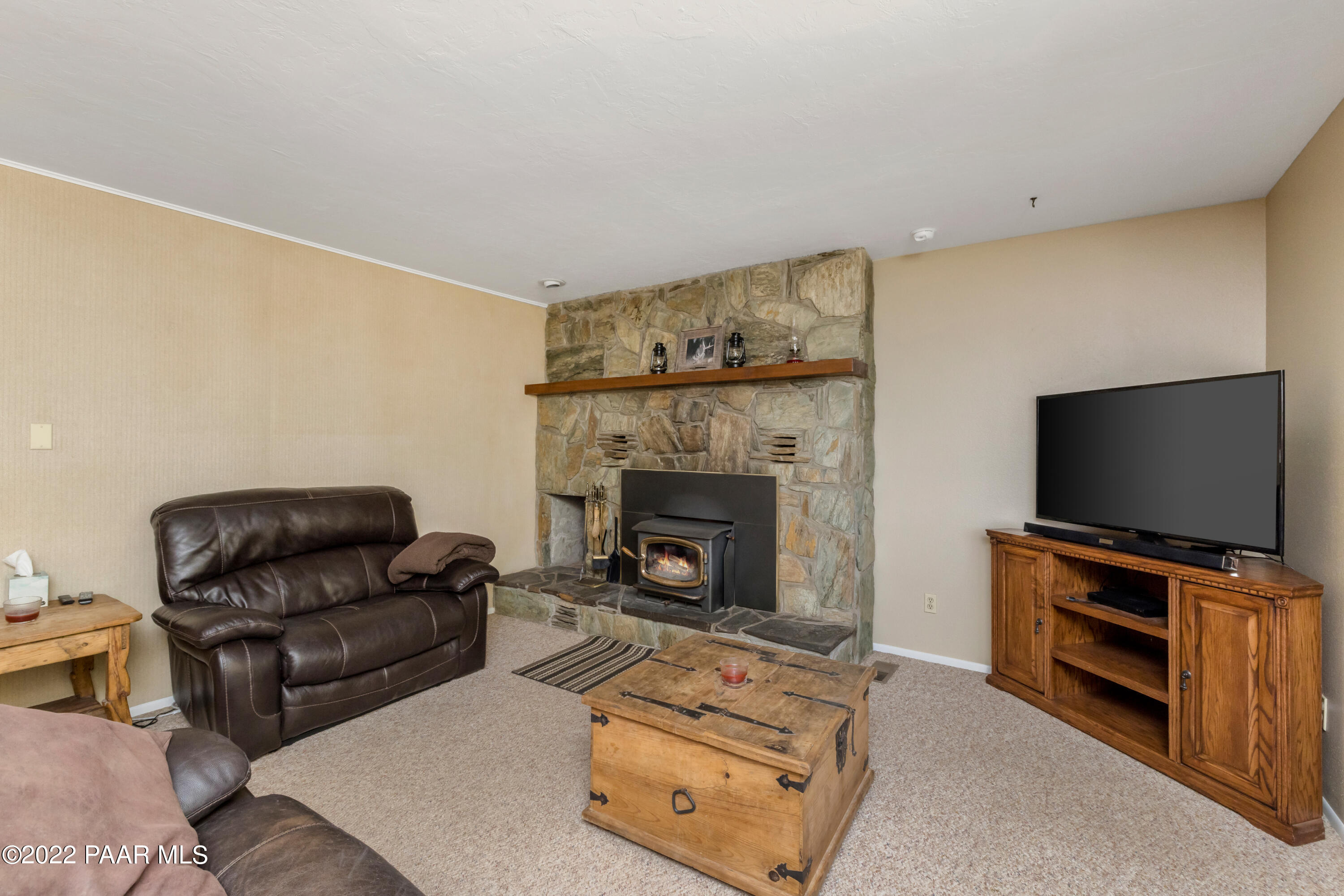 1481 West Cliff Rose Road Prescott, AZ 86305 - Photo 7 of 38 a living room with furniture and a fireplace