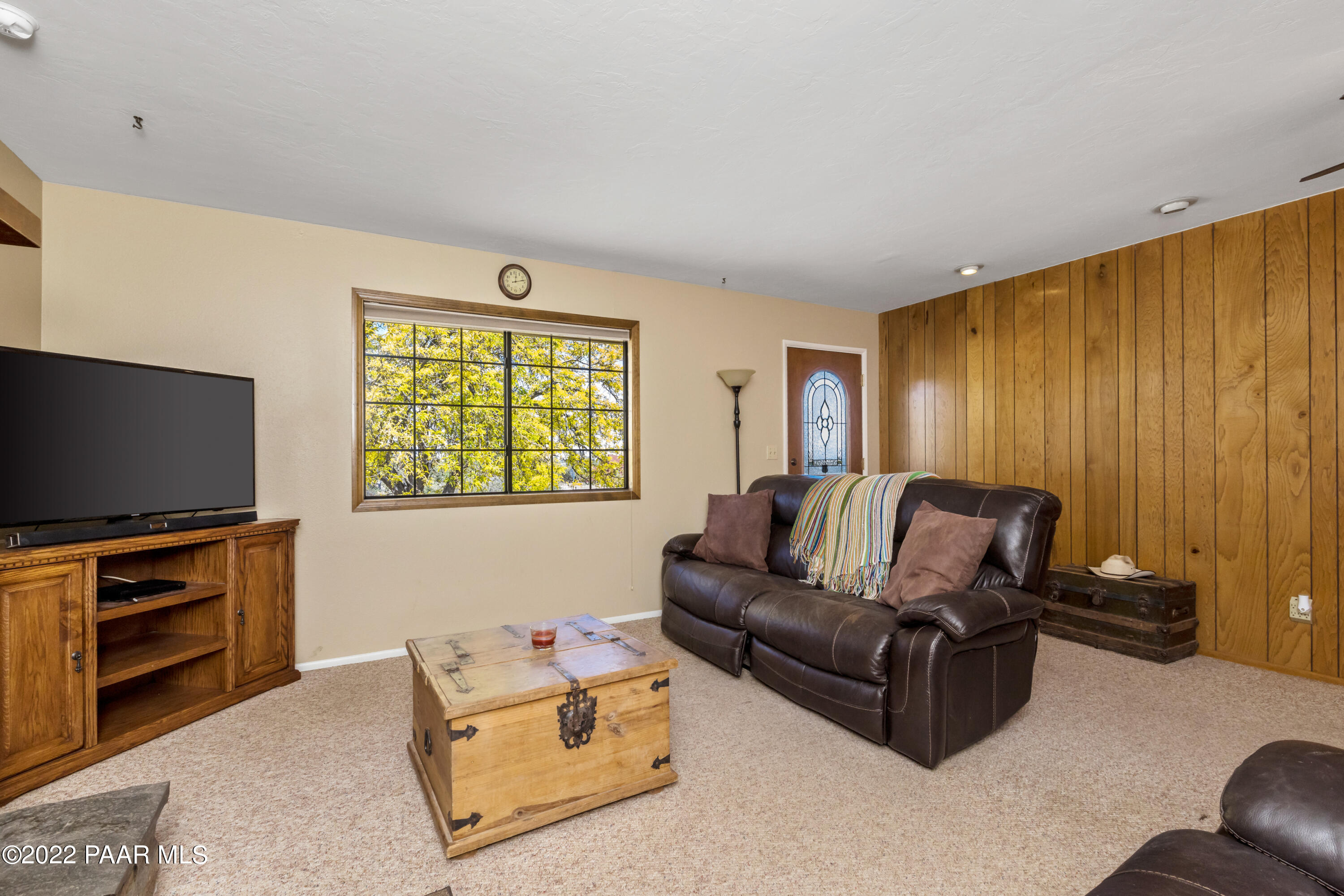 1481 West Cliff Rose Road Prescott, AZ 86305 - Photo 8 of 38 a living room with furniture and a flat screen tv