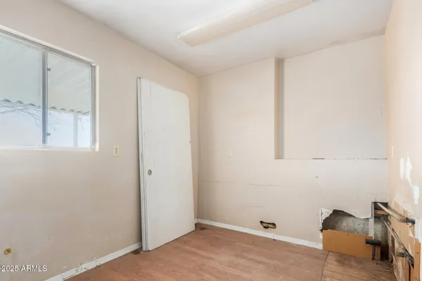 an empty room with sliding glass door
