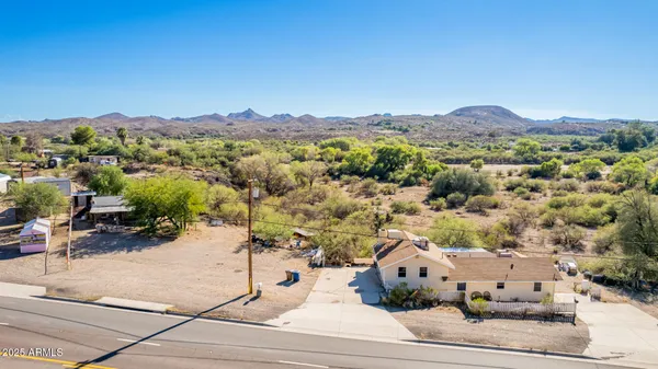 an aerial view of residential houses with outdoor space