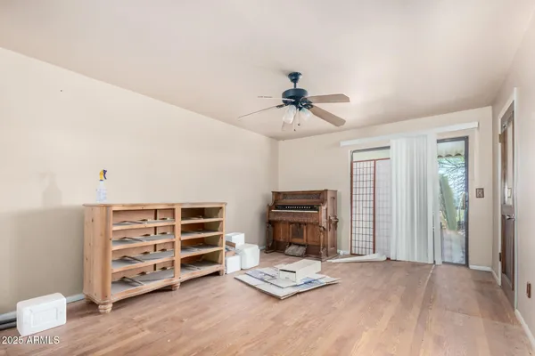 a kitchen with a table chairs a sink dishwasher refrigerator and cabinets