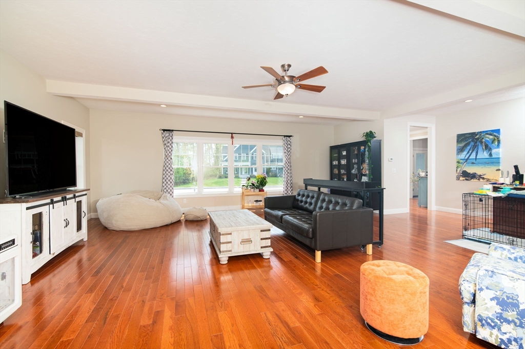 51 Tamarack Road Dracut, MA 01826 - Photo 8 of 39 a living room with furniture and a flat screen tv