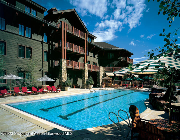 75 Prospector Road, Unit 83038 Aspen, CO 81611 - Photo 13 of 13 a view of outdoor space patio and swimming pool