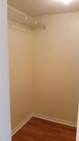 an empty room with wooden floor