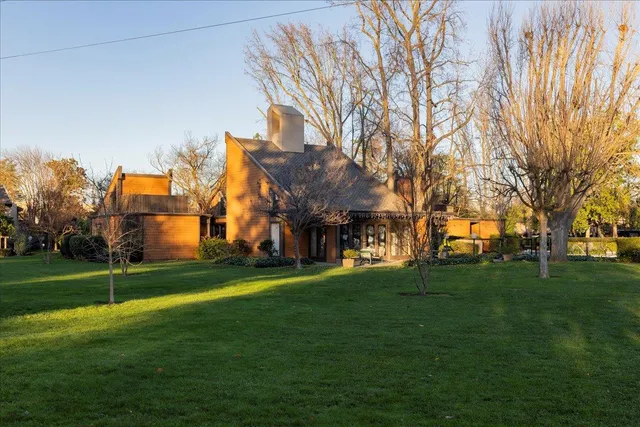a view of a yard with a swimming pool