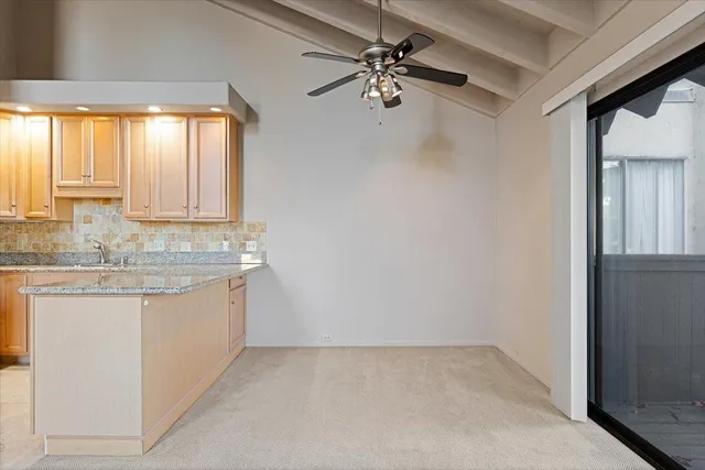 a bathroom with a granite countertop sink a mirror and a vanity